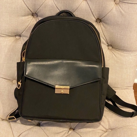 𝅺tumi medium size black leather and canvas women’s backpack